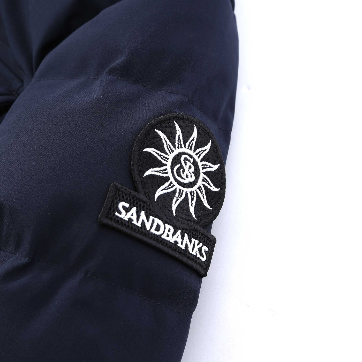 Sandbanks Branksome Long Puffer Jacket in Navy Logo